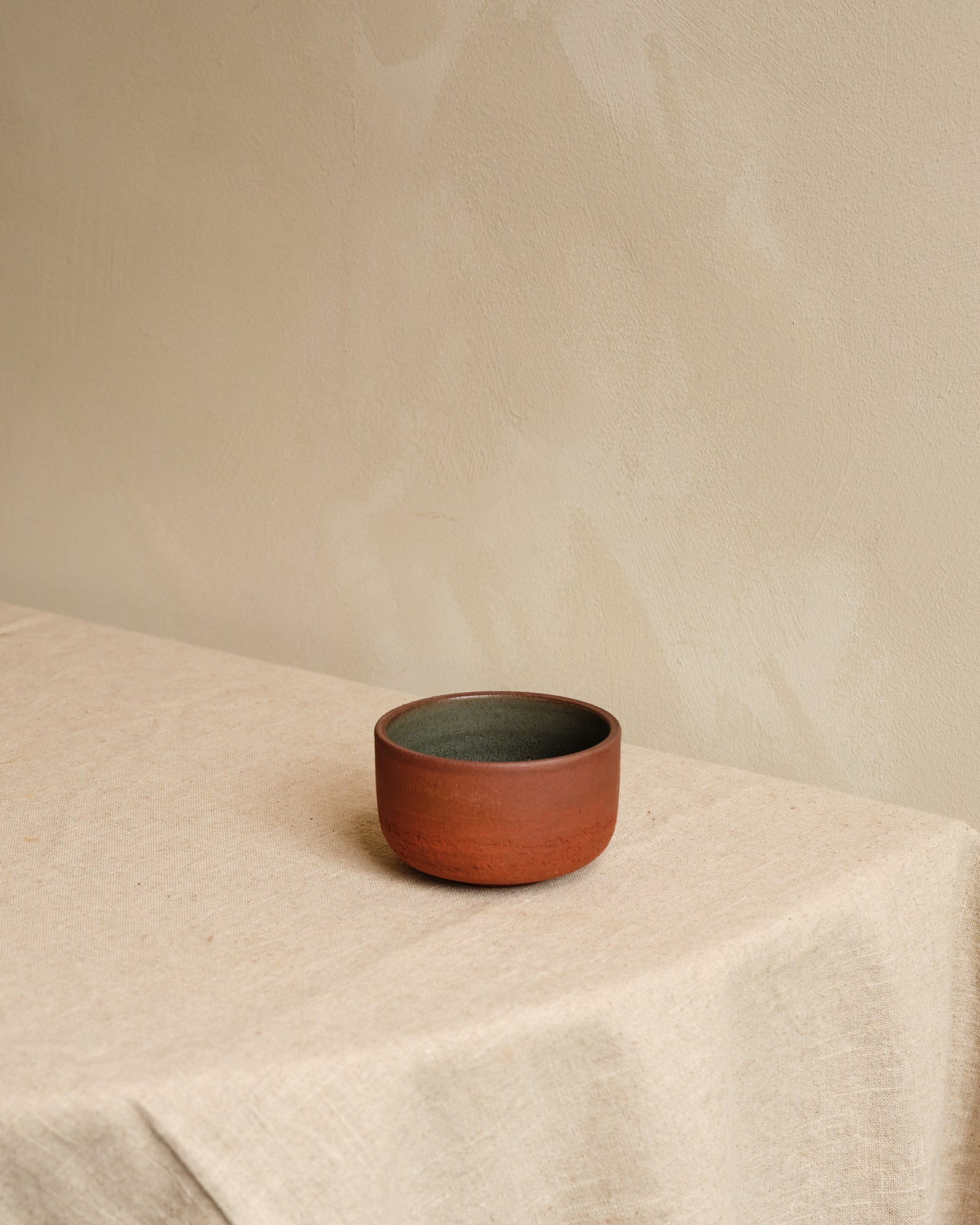 Small bowl on a beige surface with a neutral background