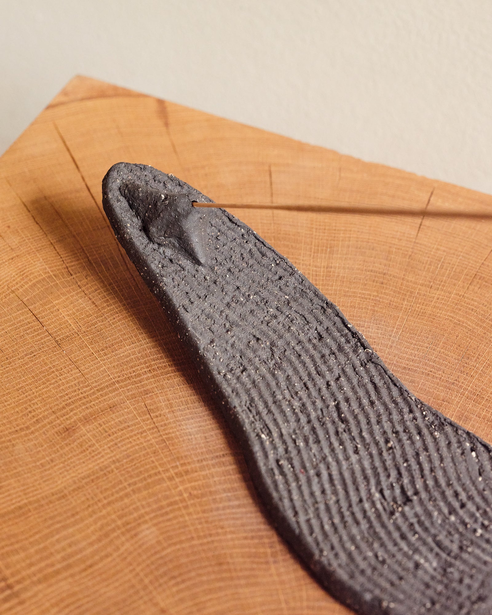 Incense holder on a wooden surface