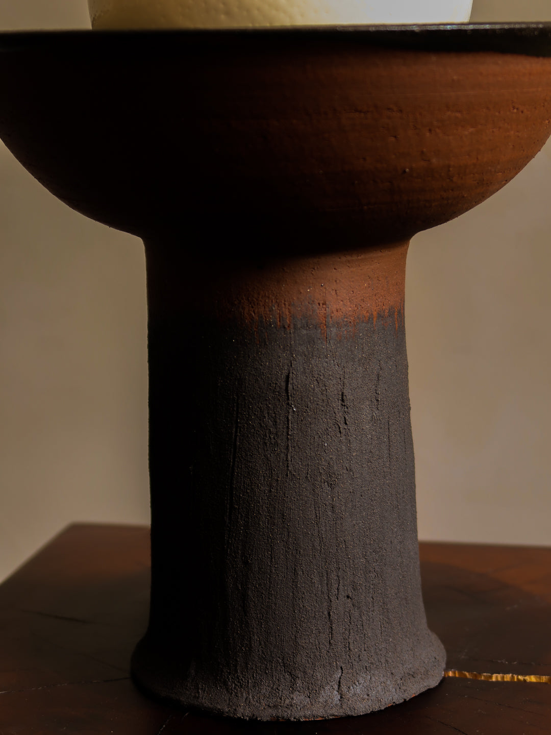 Ceramic bowl with a textured design on a plain background